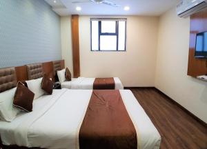 Postel nebo postele na pokoji v ubytování Hotel Airside