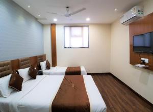 Postel nebo postele na pokoji v ubytování Hotel Airside