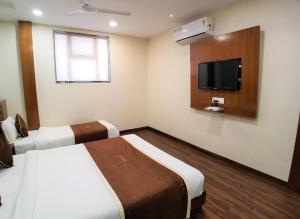 Postel nebo postele na pokoji v ubytování Hotel Airside