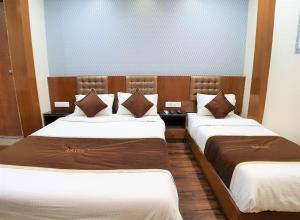 Postel nebo postele na pokoji v ubytování Hotel Airside