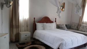 Postel nebo postele na pokoji v ubytování St Lira Hotel