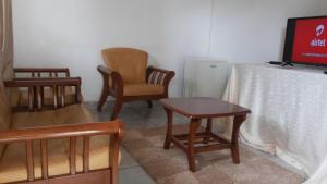 TV a/nebo společenská místnost v ubytování St Lira Hotel