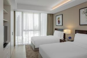 Gulta vai gultas numurā naktsmītnē Dusit Doha Hotel
