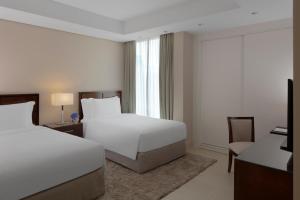 Gulta vai gultas numurā naktsmītnē Dusit Doha Hotel