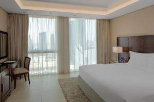 Gulta vai gultas numurā naktsmītnē Dusit Doha Hotel