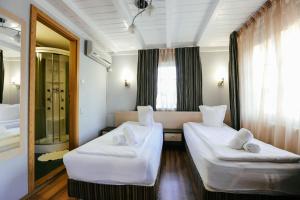 Ένα ή περισσότερα κρεβάτια σε δωμάτιο στο Vila Vidalis