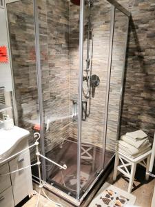 a shower with a glass enclosure in a bathroom at Country Home B&B Il Melo in Vicenza
