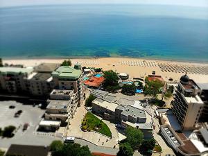 an aerial view of a beach with buildings and the ocean at HOTEL IZVORA Beach Front Suites in Golden Sands