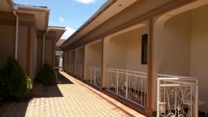 a corridor of a building with a balcony at Hotel Bucolic Heritage in Adjumani
