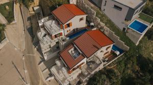 an overhead view of a house with red roofs at Apartment Patricia in Rab