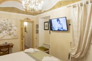Postel nebo postele na pokoji v ubytování Les Suite Royales