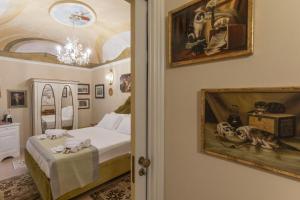 Postel nebo postele na pokoji v ubytování Les Suite Royales