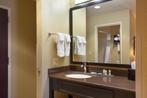 a bathroom with a sink and a mirror at La Quinta by Wyndham Meridian / Boise West in Meridian