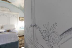Postel nebo postele na pokoji v ubytování Les Suite Royales