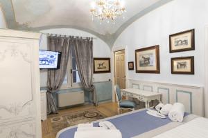 Postel nebo postele na pokoji v ubytování Les Suite Royales