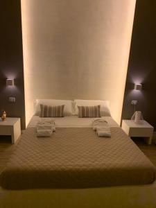 Postel nebo postele na pokoji v ubytování La Banchina Holiday Rooms