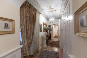 
a room with a large mirror and a rug at Les Suite Royales in Sassari
