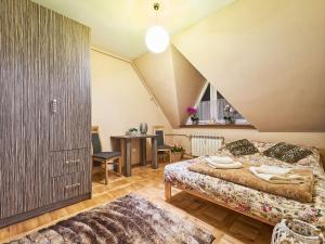 Posteľ alebo postele v izbe v ubytovaní Apartament Dwupoziomowy Pardałówka
