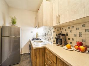 Kuchyňa alebo kuchynka v ubytovaní Apartament Dwupoziomowy Pardałówka