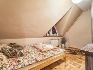 Posteľ alebo postele v izbe v ubytovaní Apartament Dwupoziomowy Pardałówka