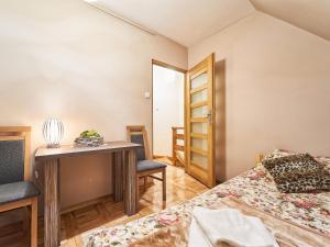 Posteľ alebo postele v izbe v ubytovaní Apartament Dwupoziomowy Pardałówka