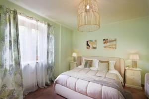 Säng eller sängar i ett rum på Villa Scarponi Assisi