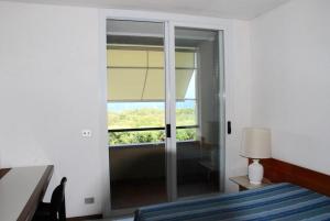 Postel nebo postele na pokoji v ubytování Due balconi sul mare