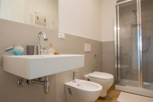 a bathroom with a sink and a toilet and a shower at B&B Querceto in Sesto Fiorentino