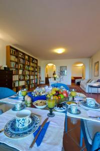 a table with plates and bowls of food on it at Il Giardino di Matilde in Perugia