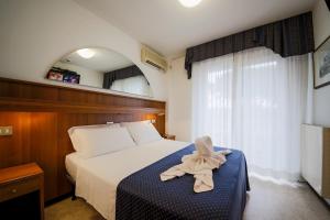 A bed or beds in a room at Hotel Vina De Mar