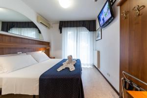 A bed or beds in a room at Hotel Vina De Mar