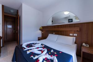 A bed or beds in a room at Hotel Vina De Mar