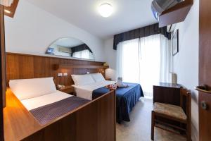 A bed or beds in a room at Hotel Vina De Mar