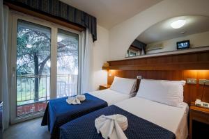 A bed or beds in a room at Hotel Vina De Mar