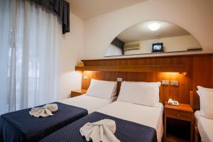 A bed or beds in a room at Hotel Vina De Mar