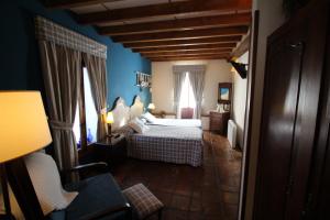 Tempat tidur dalam kamar di Posada La Llosa de Somo