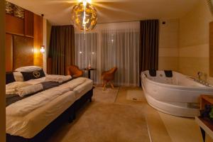 Postel nebo postele na pokoji v ubytování Baobab Suites