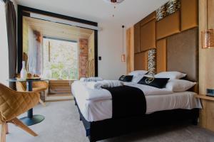 Postel nebo postele na pokoji v ubytování Baobab Suites