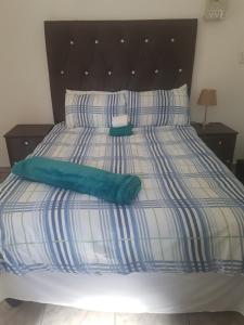 Postel nebo postele na pokoji v ubytování MZET GUEST HOUSE