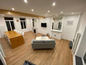 a living room with a couch and a table at Le Petit Chez Soi in Calais