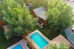 an aerial view of a house with a swimming pool at Akwakh Almzraah for Families Only in Riyadh