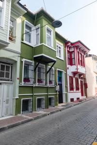 a green building on the side of a street at Dualis Hotel in Istanbul