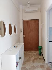 a room with a white table and a brown door at Casa Tina in Santa Margherita Ligure +8 photos