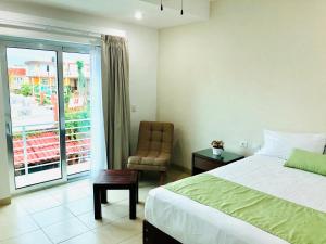 Postel nebo postele na pokoji v ubytování Imperla Hotel