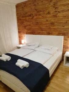 מיטה או מיטות בחדר ב-Apartament Nowe Miasto