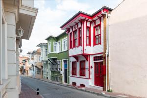 a row of colorful houses on a city street at Dualis Hotel in Istanbul