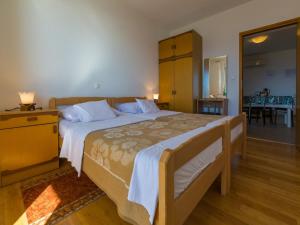 Postel nebo postele na pokoji v ubytování Apartments STIPE