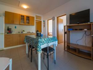 Kuchyň nebo kuchyňský kout v ubytování Apartments STIPE