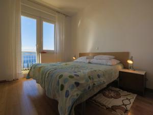 Postel nebo postele na pokoji v ubytování Apartments STIPE