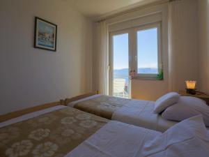 Postel nebo postele na pokoji v ubytování Apartments STIPE